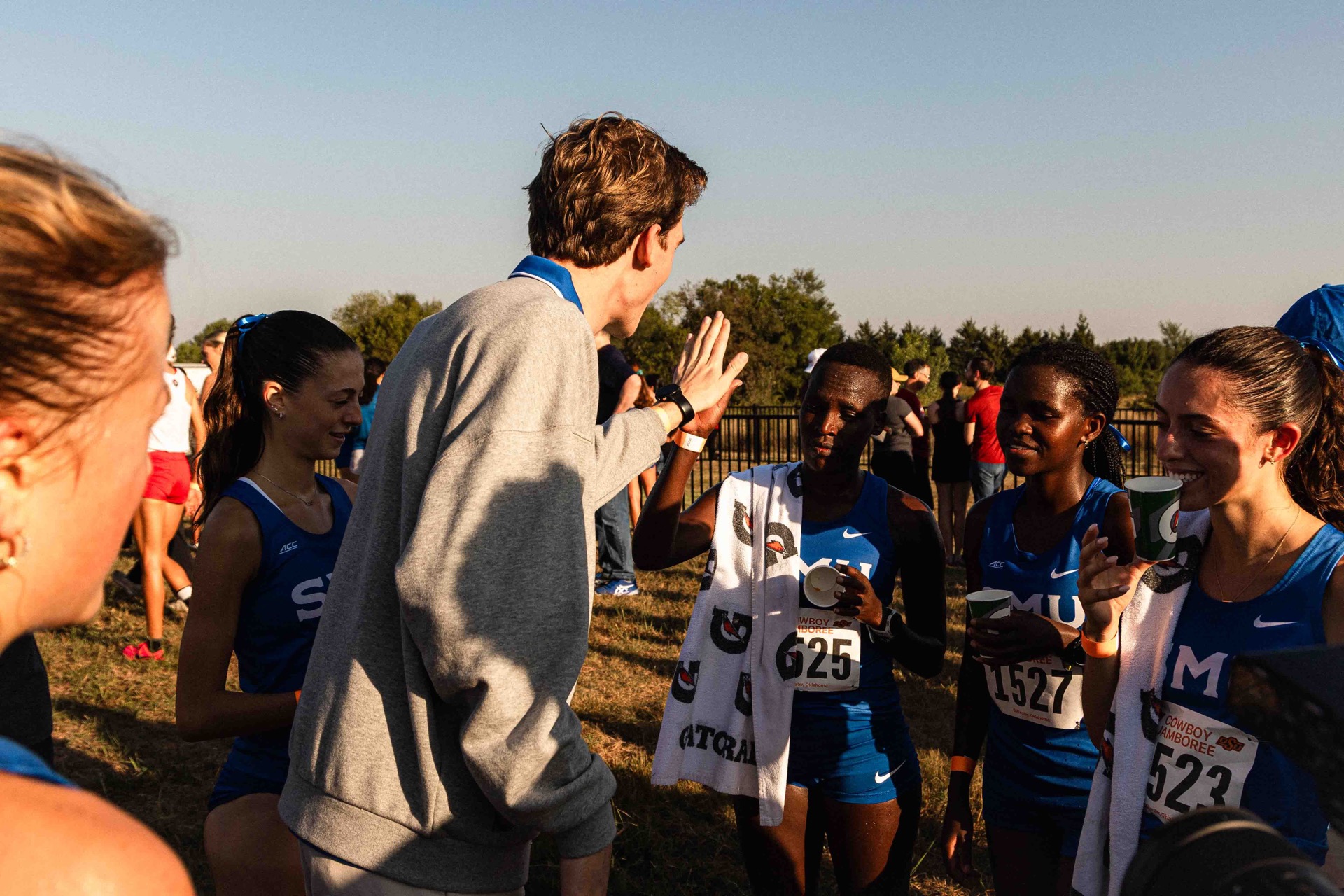 Caden Norris coaching SMU cross country athletes